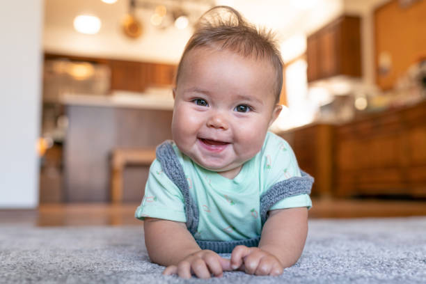 Baby laying on carpet floorings | Simple Flooring Solutions