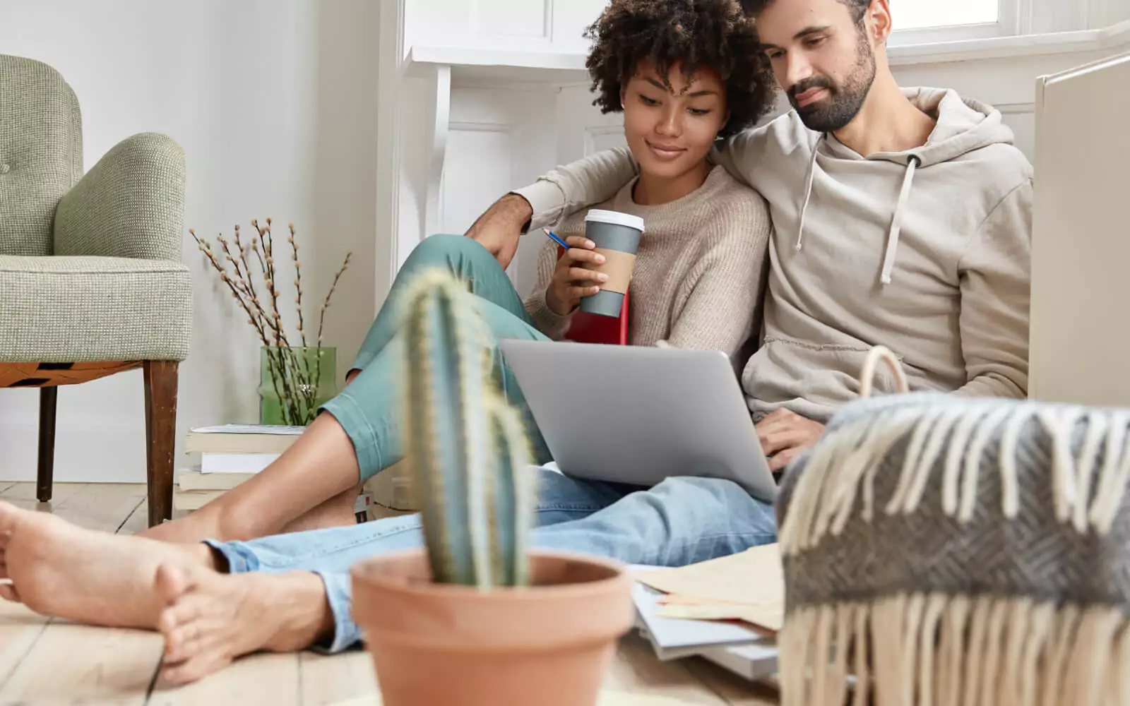 Couple looking into laptop | Simple Flooring Solutions