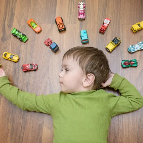 Kid playing with toy cars | Simple Flooring Solutions