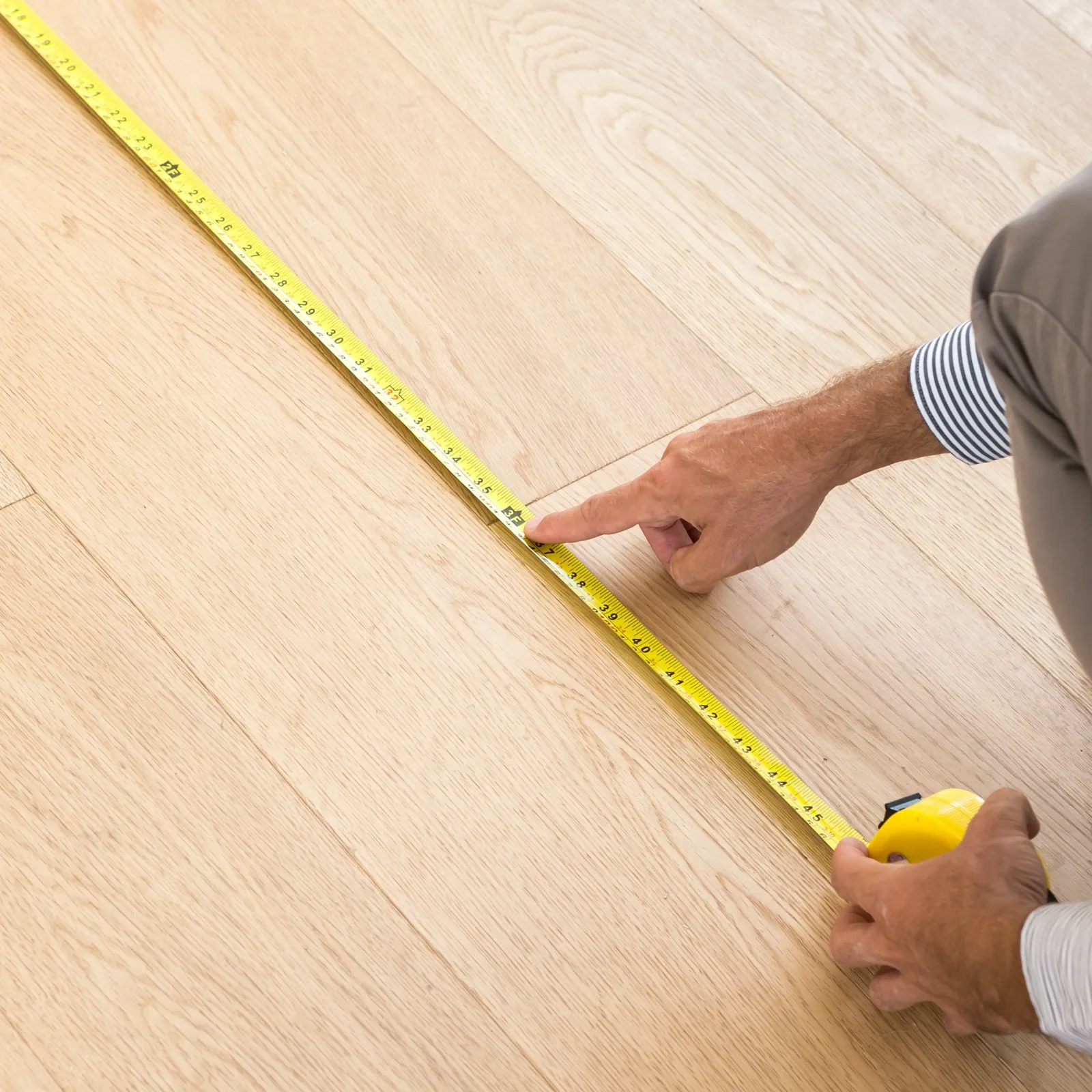 Man measuring floor | Simple Flooring Solutions